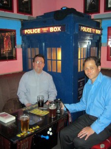 Myself and Ed Fortune sat in front of a TARDIS. Picture taken by Frances Hardinge