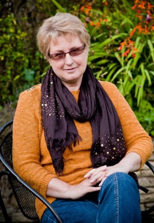 Author Picture of Terry Jackman sitting in a garden chair